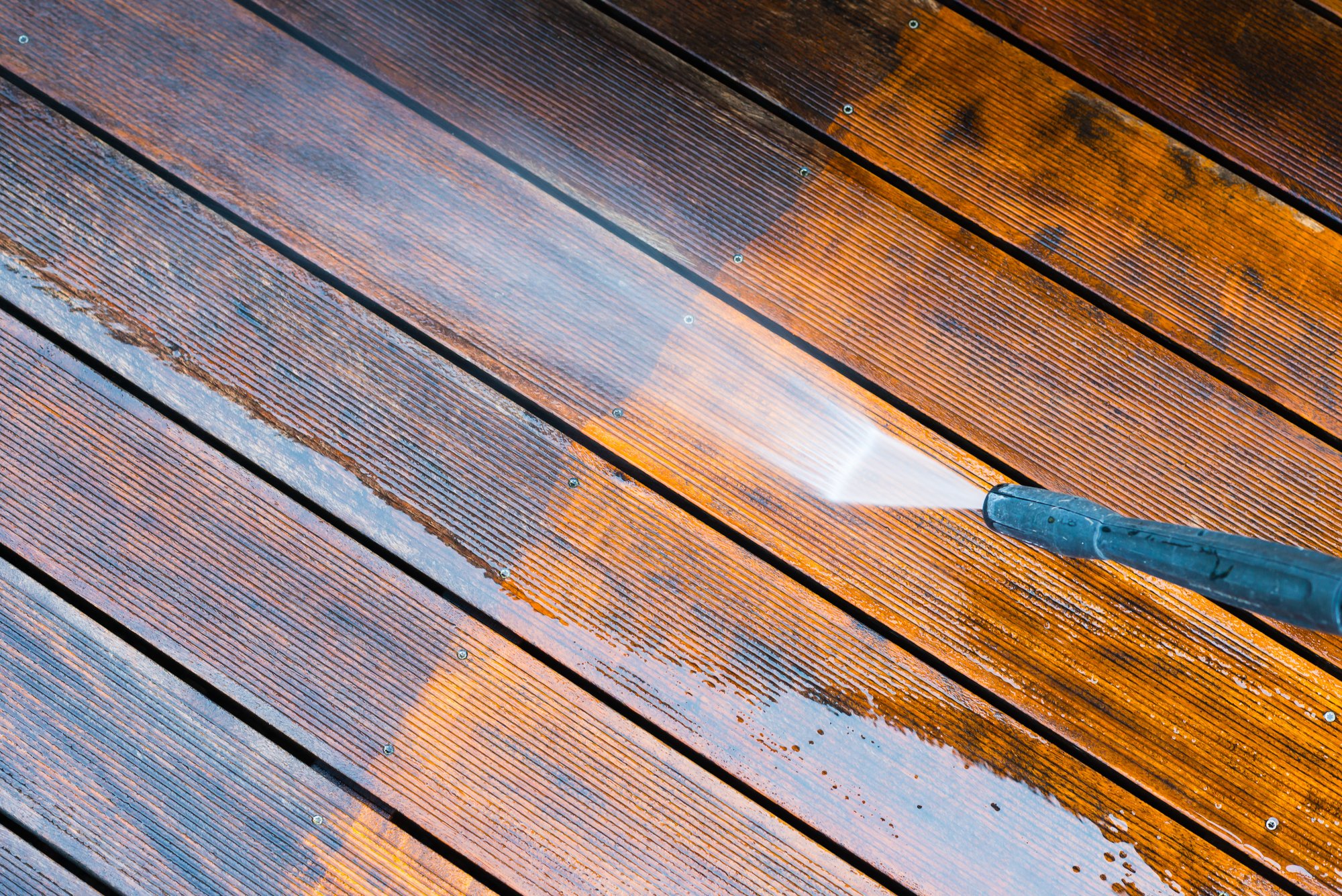 cleaning terrace with a pressure washer